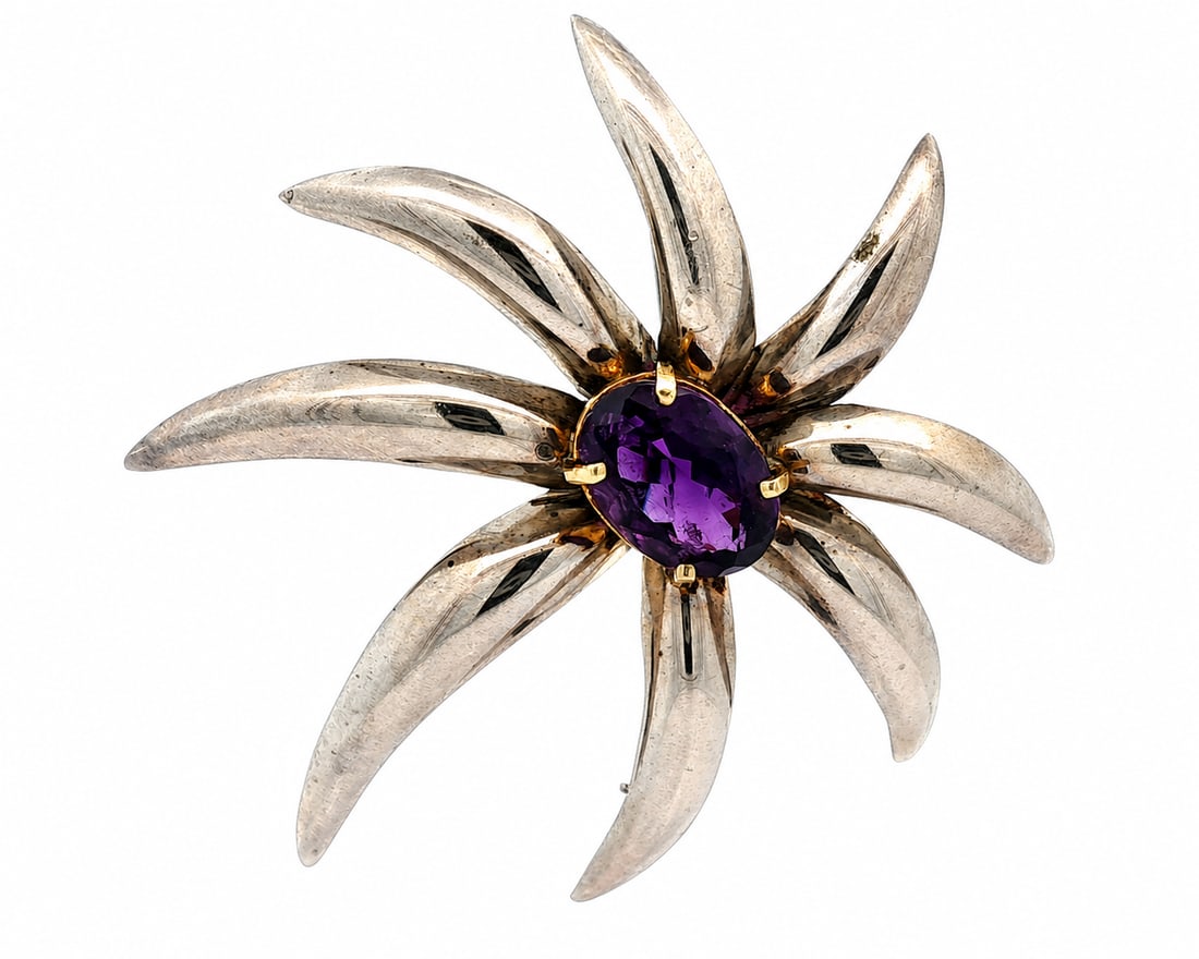 Tiffany & Co. Gold & Silver Amethyst Fireworks Brooch: Tiffany & Co. Gold & Silver Large Oval Deep Purple Amethyst Fireworks Pin Brooch ?Stone(s)?(1) Natural Genuine Amethyst - Oval Cut - Prong Set - Deep Purple Color - 15.3x10.8mm (approx.)Material: Ster