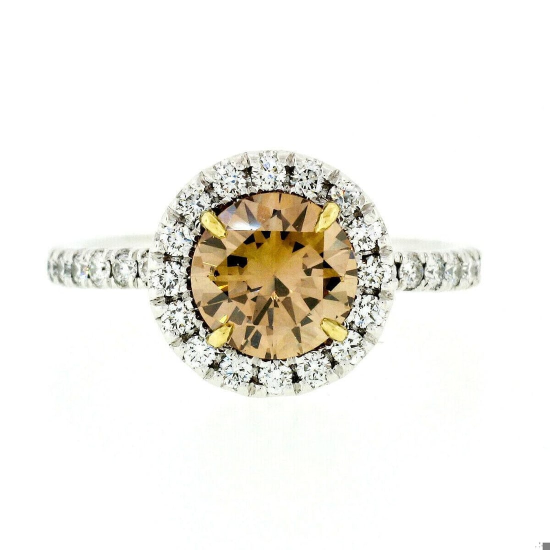 18k Gold Diamond Solitaire Halo Engagement Ring: 18k Gold 1.56ctw GIA Fancy Orange Brown Diamond Solitaire Halo Engagement Ring. This gorgeous diamond engagement ring is crafted in solid 18k white gold and features an amazing, 1.06 carat, GIA
