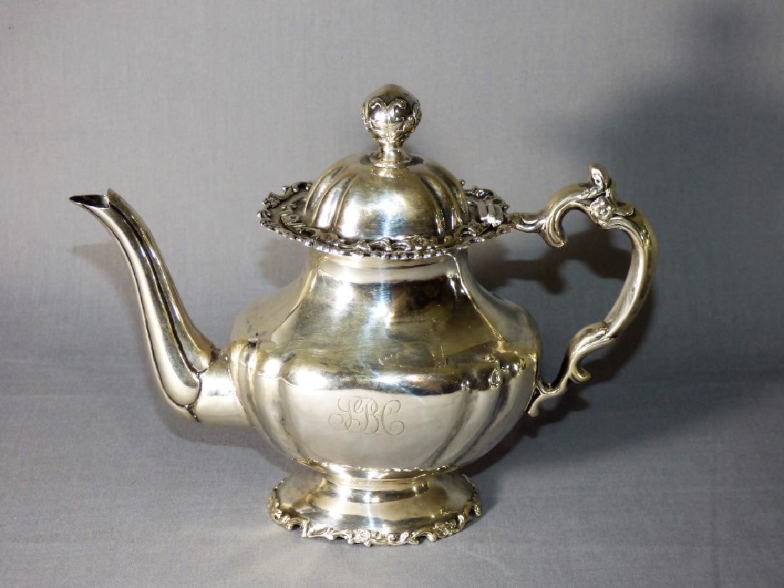 A Van Buren Sterling Silver Tea Pot: A Van Buren Sterling Silver Tea Pot, with finely chased and repoussed Neoclassical motifs Approximate weight 9 ozt.