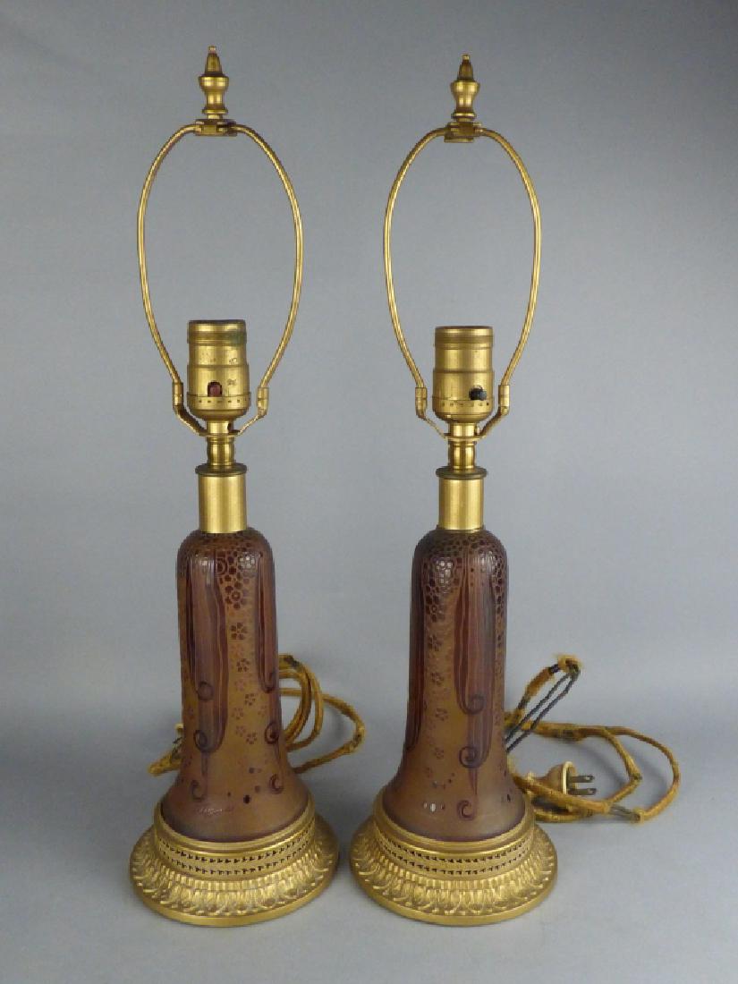 Pair of D'Argental Cameo Glass Table Lamps: Pair of antique D'Argental cameo glass lamps. Size: 18 1/2" H (overall) CONDITION: One lamp with prior restoration to glass at upper; rewiring recommended prior to use.