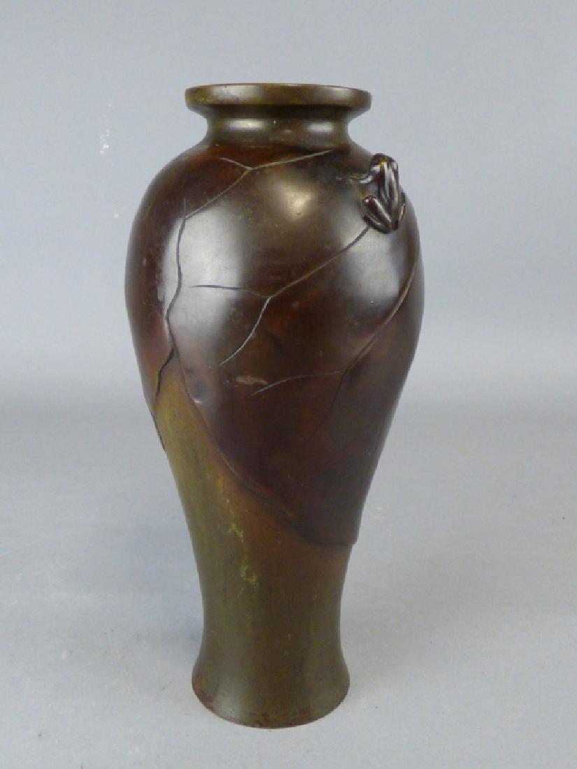 Antique Japanese Bronze Vase: Meiji Period, of tapering lobed form, depicting butterflies in relief, signature cartouche to base. Size: 3 1/2" dia. x 9" H CONDITION REPORT: The surface having been previously buffed.