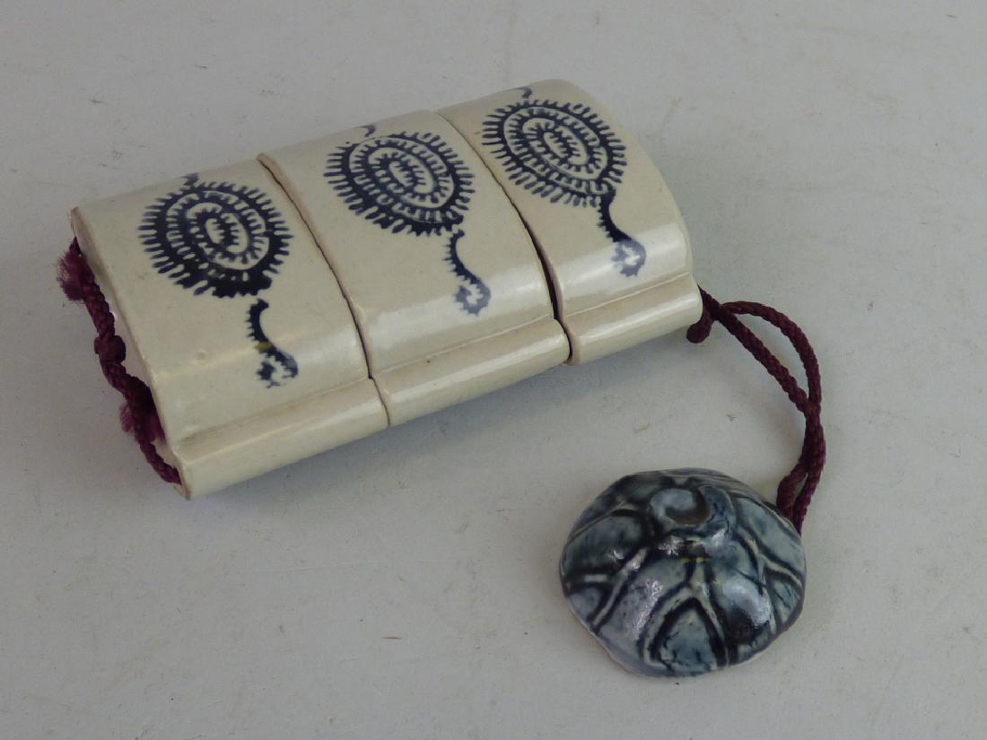 Three-Case Porcelain Inro: Size (inro only): 4" H x 2 3/4" L x 1 1/2" W