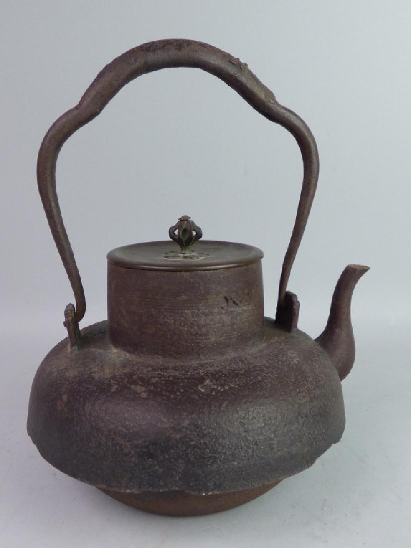 Antique Japanese Cast Iron Teapot: With bronze cover Size: 9 1/4" H (inclusive of handle) x 7 1/2" L (to spout) x 6 1/2" W
