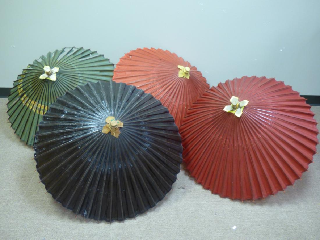 Four Japanese Paper Parasols or Umbrellas: Size (largest): 29 1/2" H x 2" dia. (closed); 40" dia. (opened)