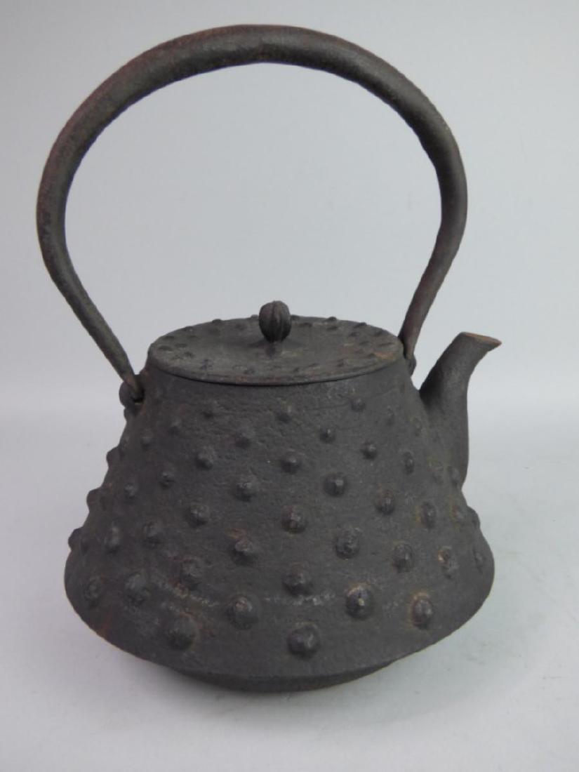 Antique Japanese Cast Iron Tetsubin Teapot: Signed to one side at lower. Size: 10" H (inclusive of handle) x 7 1/2" L (to spout) x 6 1/2" W