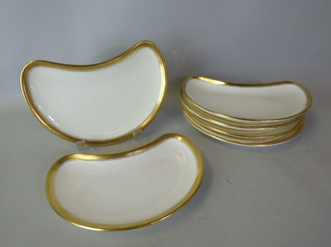 Six English Minton Porcelain Bone Dishes: Six similarly decorated Minton parcel-gilt porcelain bone dishes, comprising two examples marked to reverse with Minton mark in overglaze puce and retailer mark of T. Goode & Co., London; and four exa