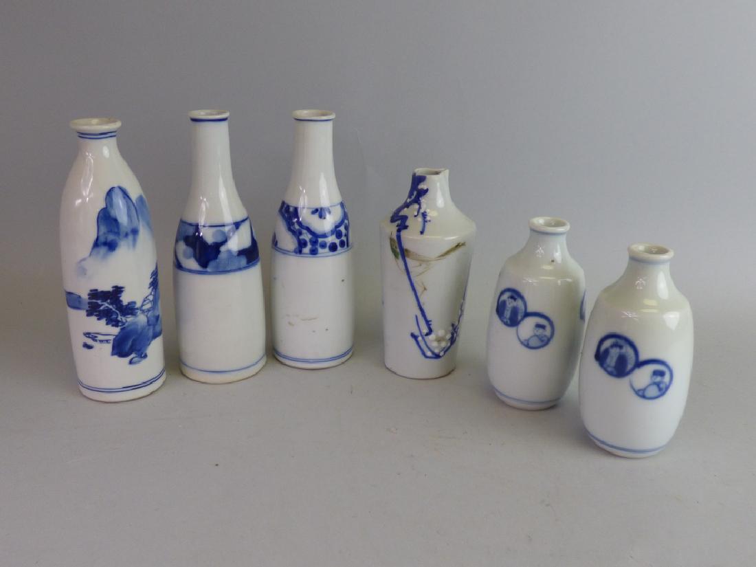Group of Six B/W Porcelain Sake Tokkuri: Size (largest): 7 1/4" H x 2 3/8" dia.