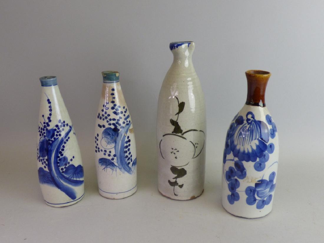 Group of Four Antique Porcelain Sake Tokkuri: Size (largest): 11" H x 3 1/2" dia.