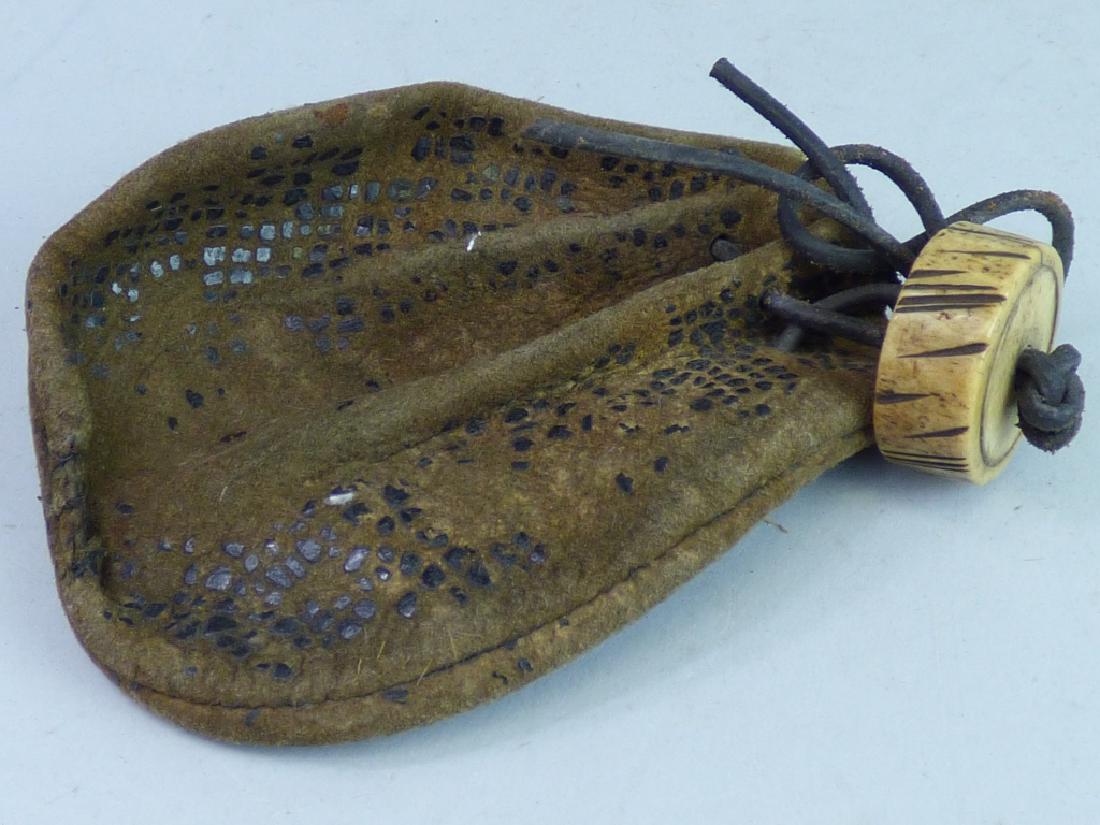 Japanese Tobacco Pouch: with antler netsuke Size (pouch): 4 1/2" L x 3 3/4" W; 1/2" H x 1 1/4" dia. (netsuke)