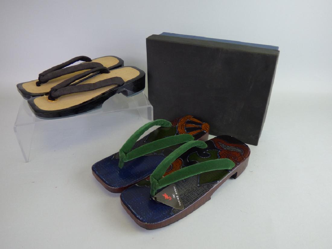Yukiko Hanai, Pair of Designer Geta Sandals: Together with an additional pair of contemporary manufacture. Size (each): 1 3/4" x 10 1/2" L x 3 3/4" W
