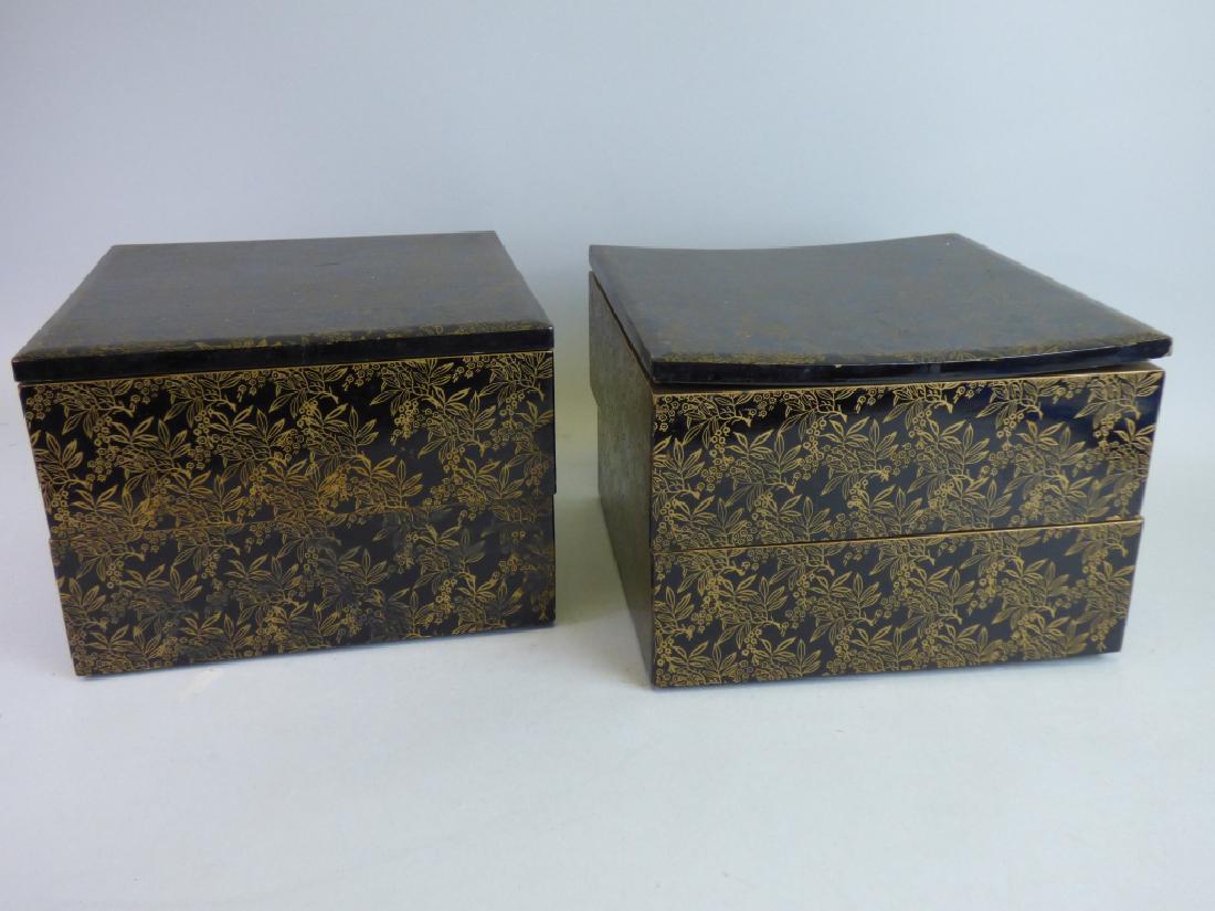 Two Lacquered Stacking Boxes: Size (each): 6 1/4" H x 8 3/4" L x 8 3/4" W CONDITION REPORT: each with losses throughout; the cover of one box with evident warping