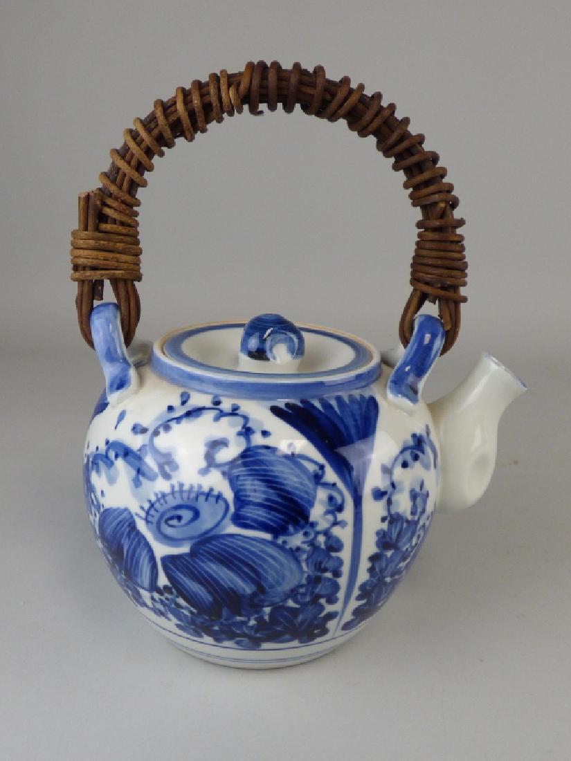 Blue & White Teapot with Woven Handle: 10" H x 8" L x 6.5"