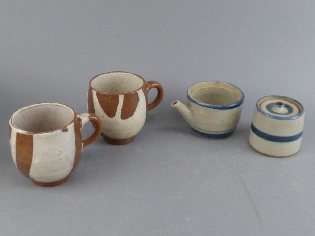 4 Piece Pottery: 2 Cups teapot./sugar 3" H x 4" L x 2.75" W