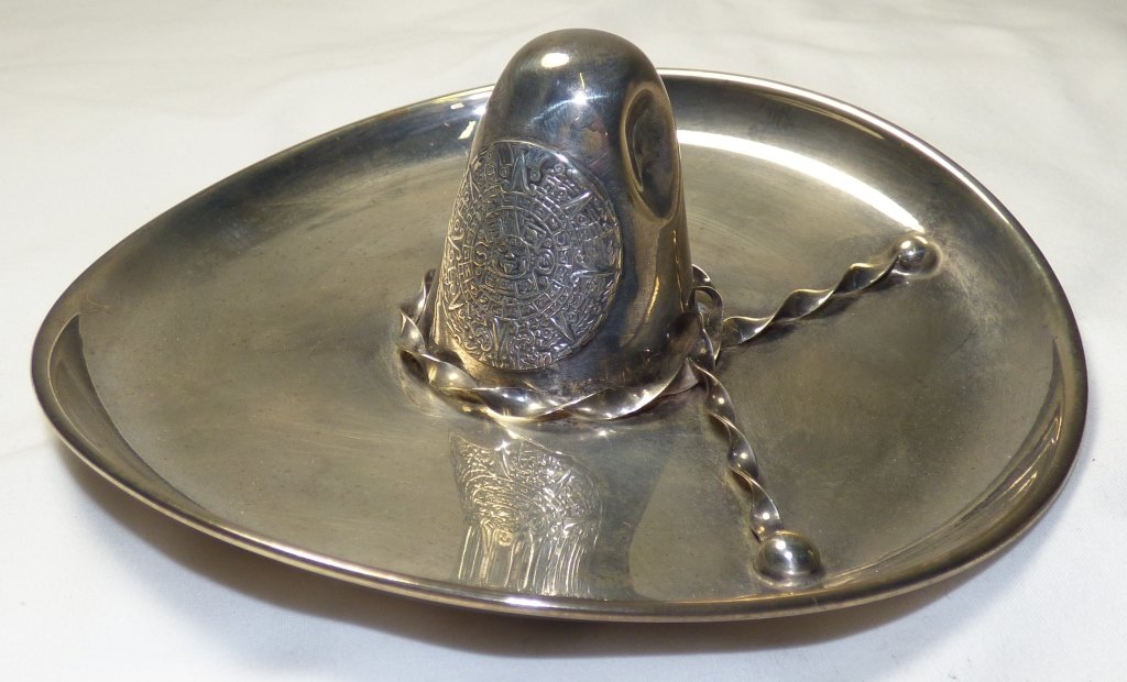 A Mexican Sterling Silver Model of a Sombrero: The base marked C. Plat-Mex, Sterling 925, ME-15-Mexico. Approximate weight 122 grams/3.92 ozt. Size: 4" L