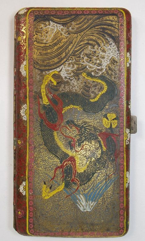 A Japanese Engraved Damascene Cigarette Case: Second half 19th century, Japanese antique damascene cigarette case, engraved both inside and outside, of dragon and mountain scape deigns.SIZE: 6.35" X 3.125"