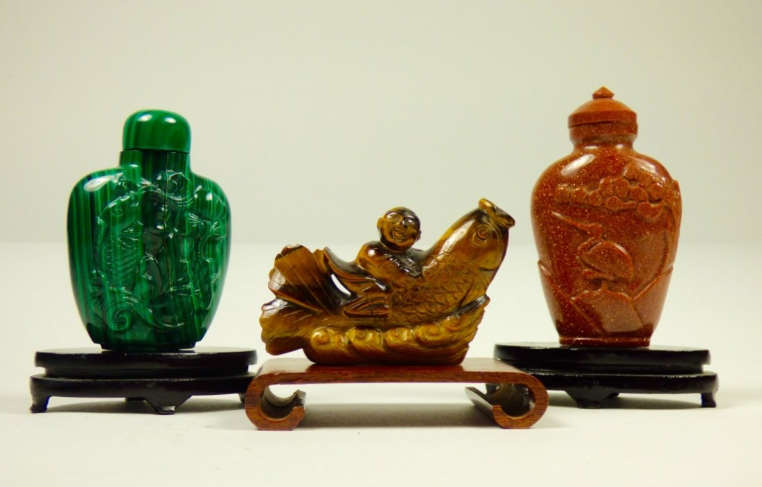 Three Chinese Carved Stone Snuff Bottles: The group comprising one goldstone example, one malachite example, and one tiger-eye example. Provenance: Property from the Collection ofDr. J. Martin Barrash, Houston, Texas