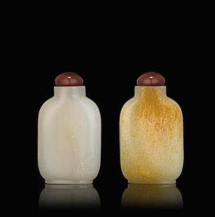 An Antique Chinese Qing White Jade Snuff Bottle: An antique white jade snuff bottle, with russet skin on one side, reverse side carved with a bamboo stalk with sparse leaves, Qing dynasty, 18-19th century.Provenance: Bonham's Fine Chinese Works of A