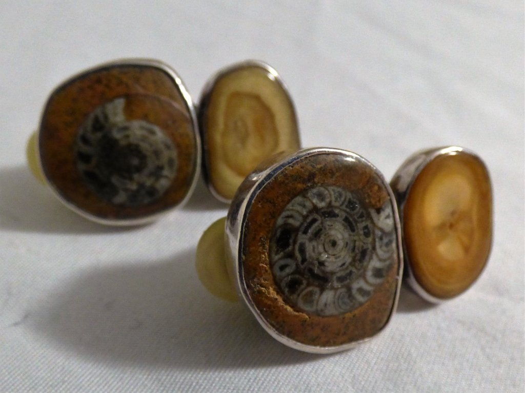 Pair of Rebecca Collins Sterling Silver Ear Clips: From the "Bless Our Earth" Series, each with dual stone inserts within the sterling mount and clip-on closure, the reverse signed Rebecca Collins, Dallas, Texas, Bless Our Earth, Copyright, and Sterli