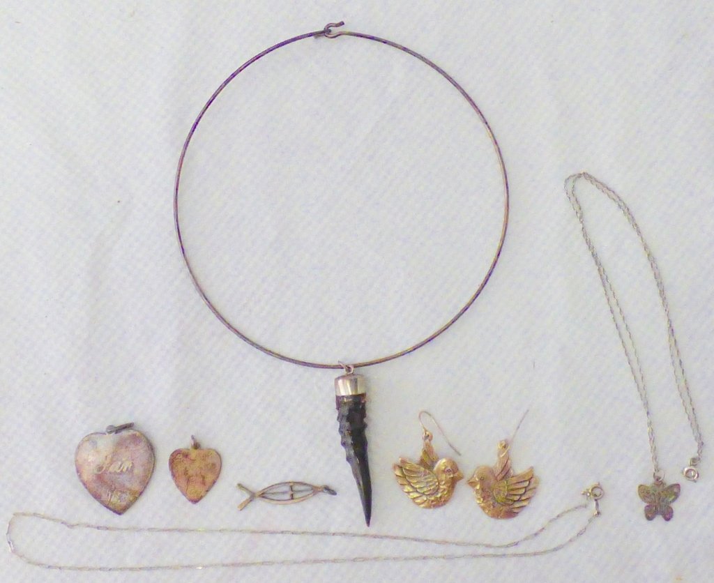Assembled Group of Sterling Silver Jewelry: Comprising two Tiffany & Co. heart-form pendants, respectively monogrammed JAN and JUR, marked Tiffany & Co. and Sterling to reverse; a chain necklace; a necklace with butterfly pendant; an Ichthus an
