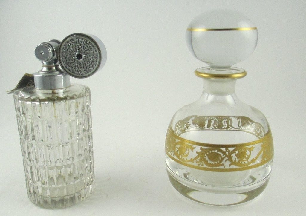 St. Louis Crystal and Baccarat Crystal Perfumes: Comprising one St. Louis crystal perfume bottle with gilt painted accents and one Marcel Franck perfume atomizer, likely Baccarat, unmarked. Size: 5 1/2" height (largest)