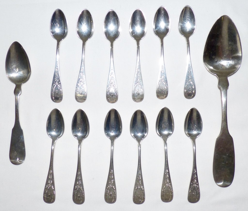 Fourteen American Coin Silver Spoons: Comprising twelve tea spoons by Farrington & Hunnewell, Boston, MA., one serving spoon by H.P. Buckley, New Orleans, LA, and one table spoon by Knowles & Ladd, Providence, RI, each marked.