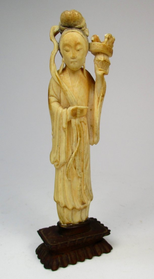 An antique Chinese ivory carving of a lady (1 of 3)