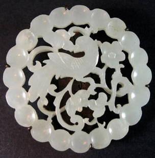 Antique Chinese Silver-Mounted Carved Jade Plaque: A Chinese circular jade reticulated plaque, circular design with a bird in the middle, now molded as a pin, Jade, late Ming to early Qing dynastyProvenance: Property from a Private Estate