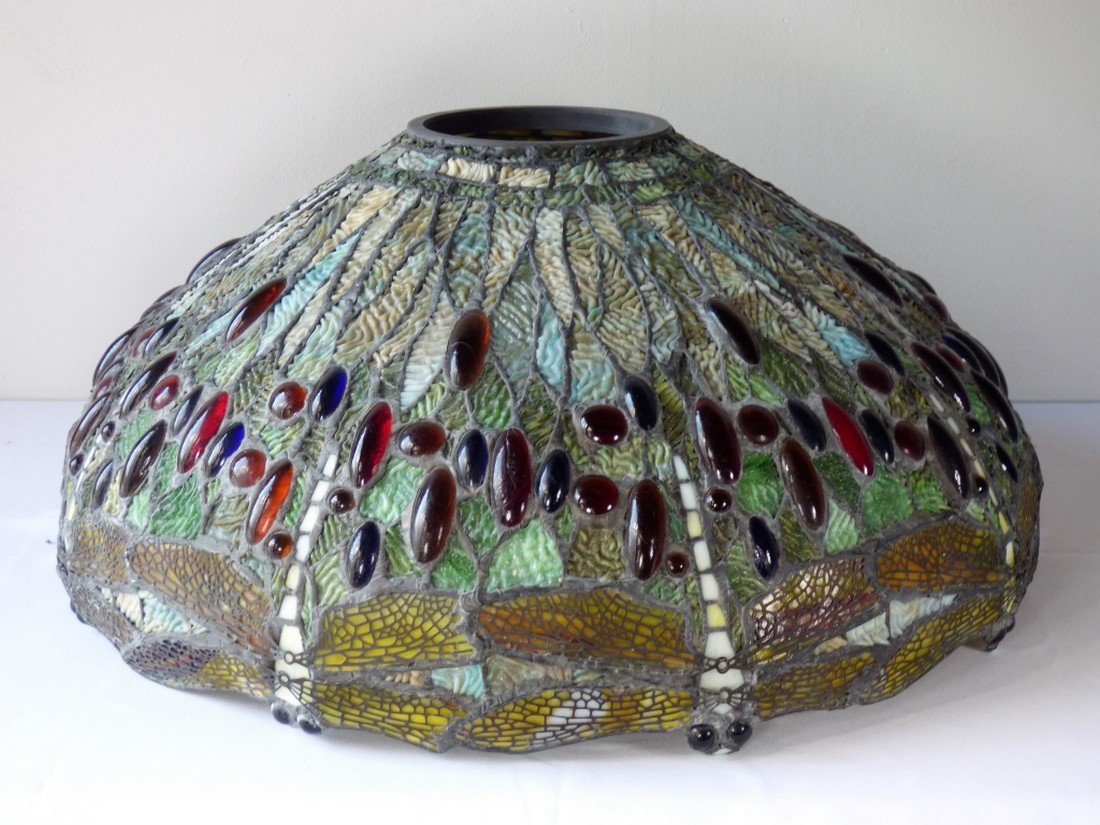 A Leaded Glass "Dragonflies" Lampshade: In the Tiffany style, 20th century, Lacking mounts. Size: 22 1/4" dia. x 9 3/4" H