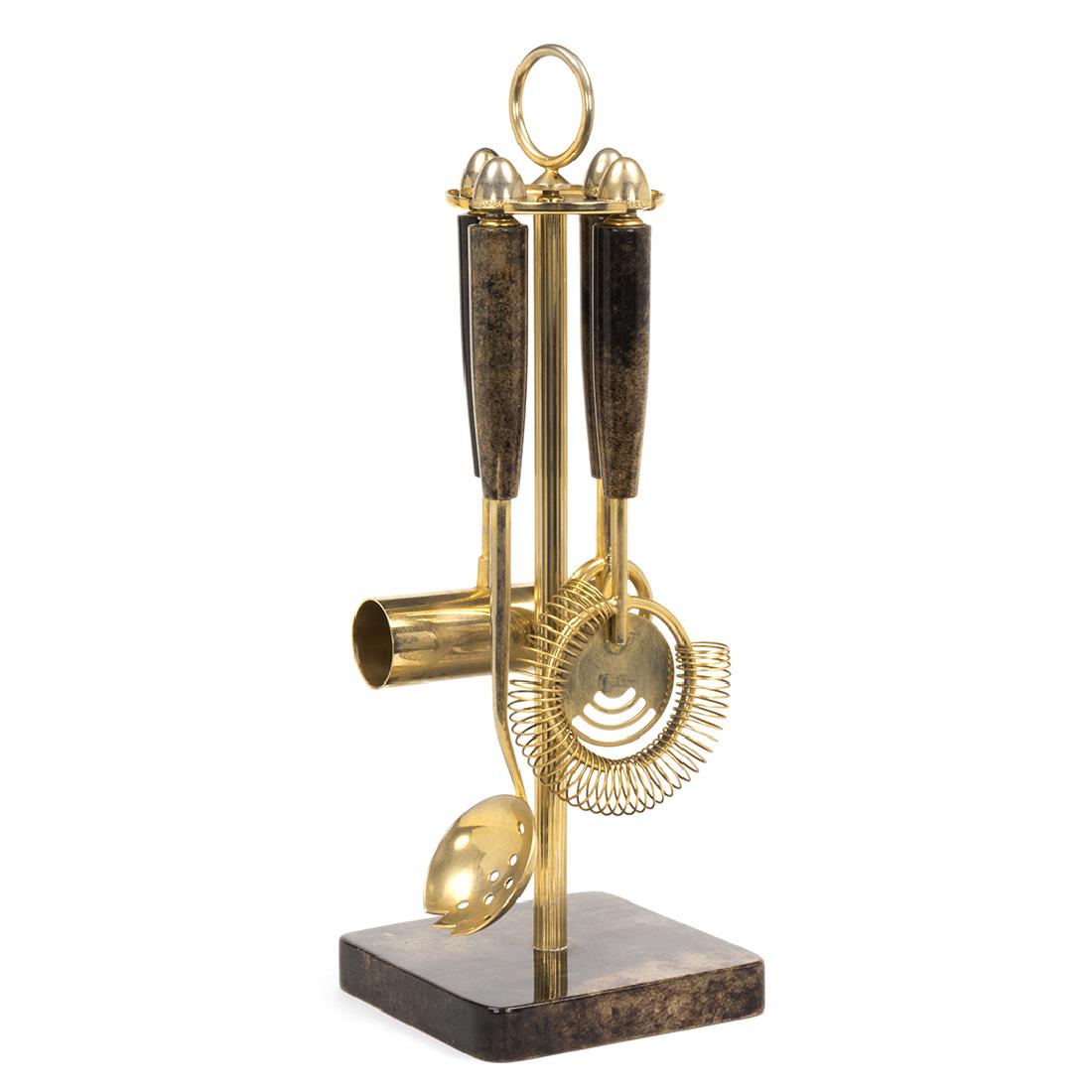 Aldo Tura Goatskin Bar Tools: Brass and goatskin wrapped bar tools by Aldo Tura, 1970s. Set includes spirits measure, bottle opener, martini strainer and ice scoop. 14.5".