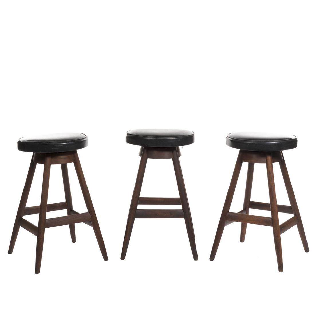 Torbjorn Strandgard Bar Stools: Set of three rosewood bar stools with vinyl upholstery by Torbjorn Strandgaard for Frem Rojle, 1960s. 29" H x 17" W x 12" D.