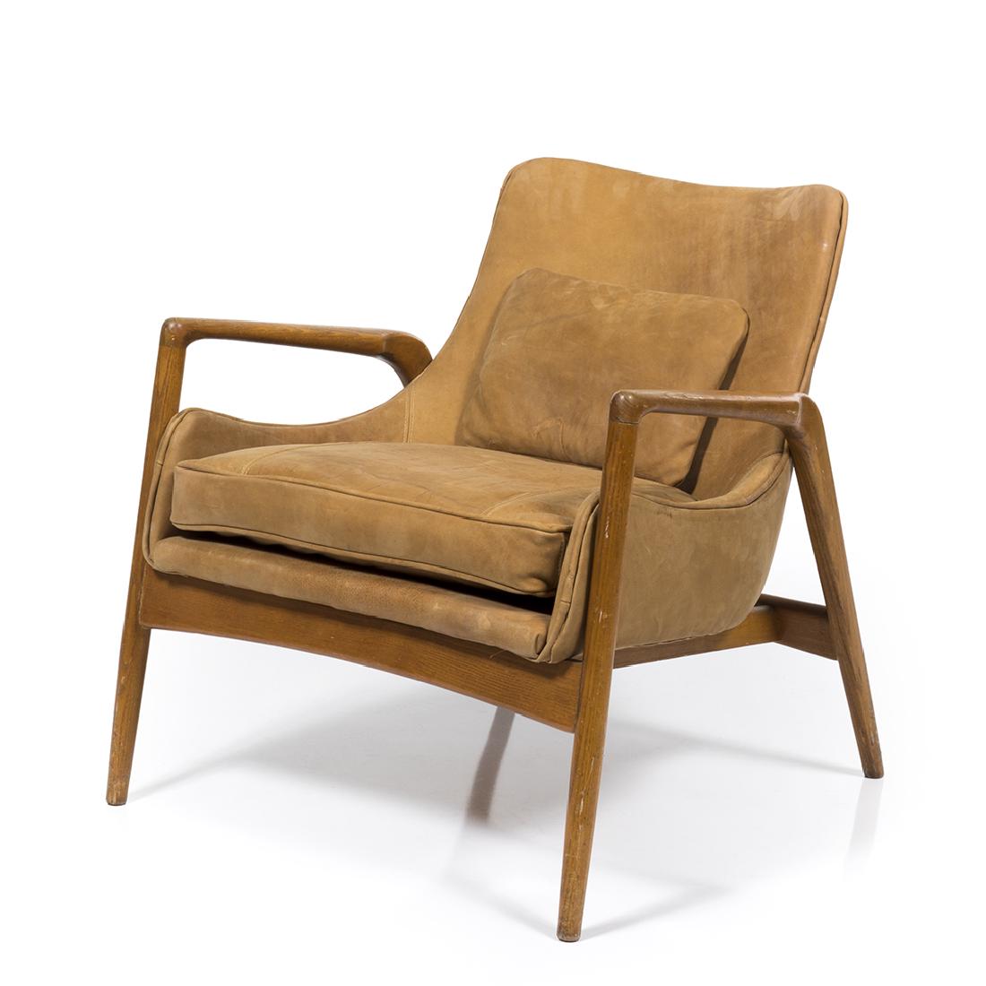 Kofod Larsen Lounge Chair: Oak framed lounge chair with leather upholstery by Kofod Larsen for Selig, Denmark 1960s.