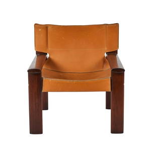 Sergio Rodriguez Lounge Chair: Rosewood and leather chair attributed to Sergio Rodrigues, Brazil 1960s. Signed with OCA label. 29H x27W x25D inches