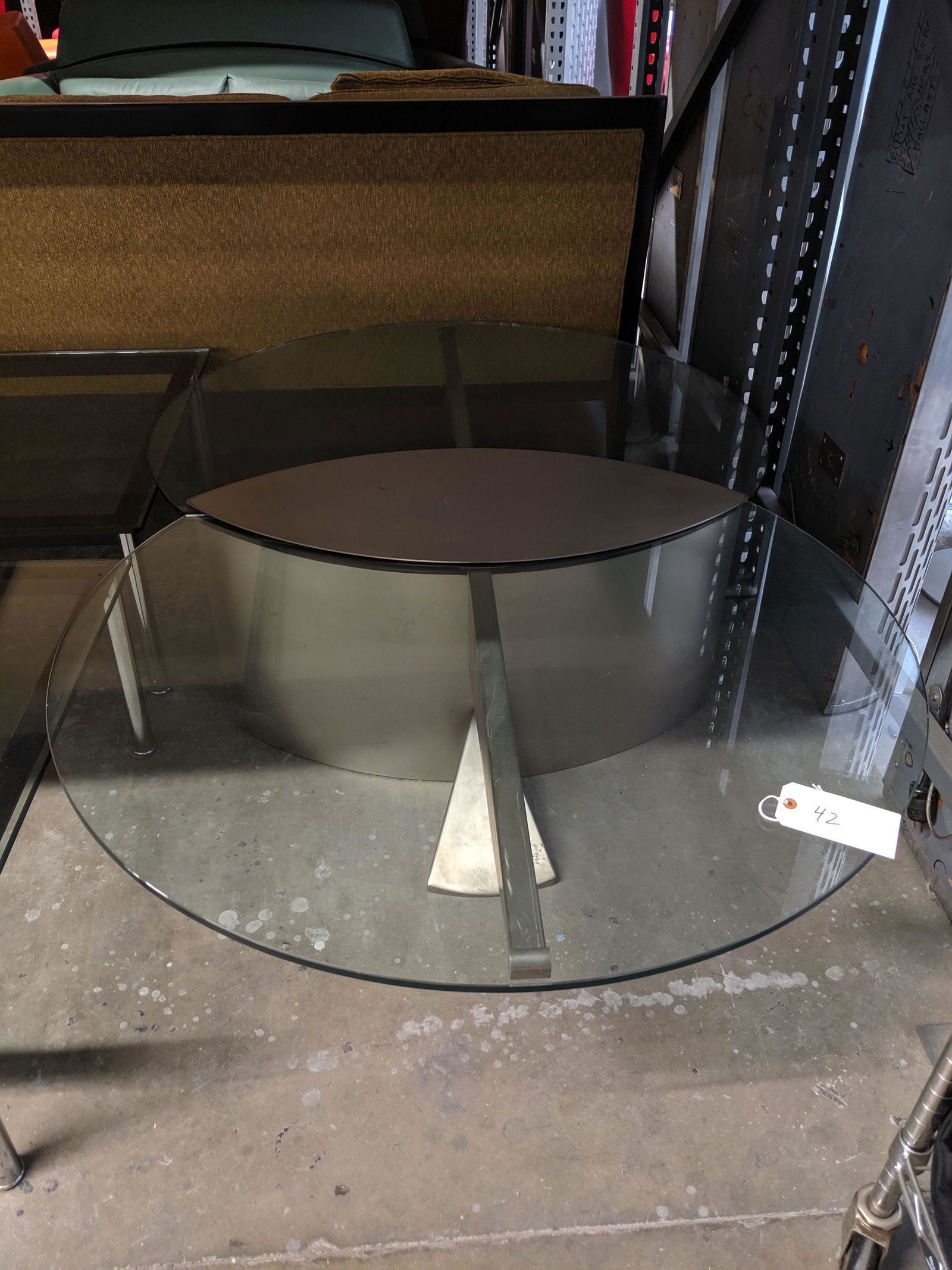 Metal and Glass Coffee Table: Metal coffee table with two glass surfaces.