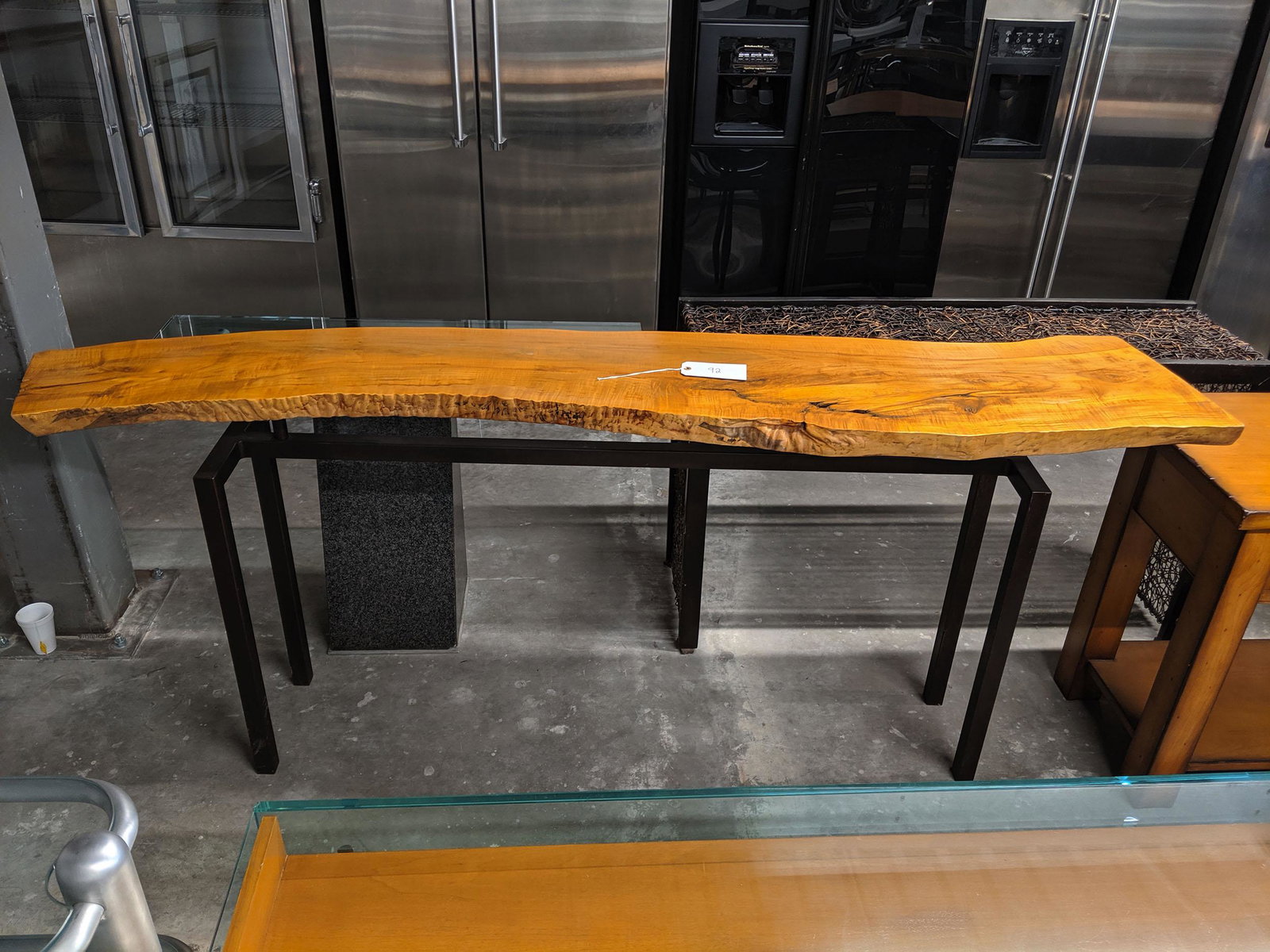 Free Edge Console Table: Console table with free edge wooden to and metal legs.