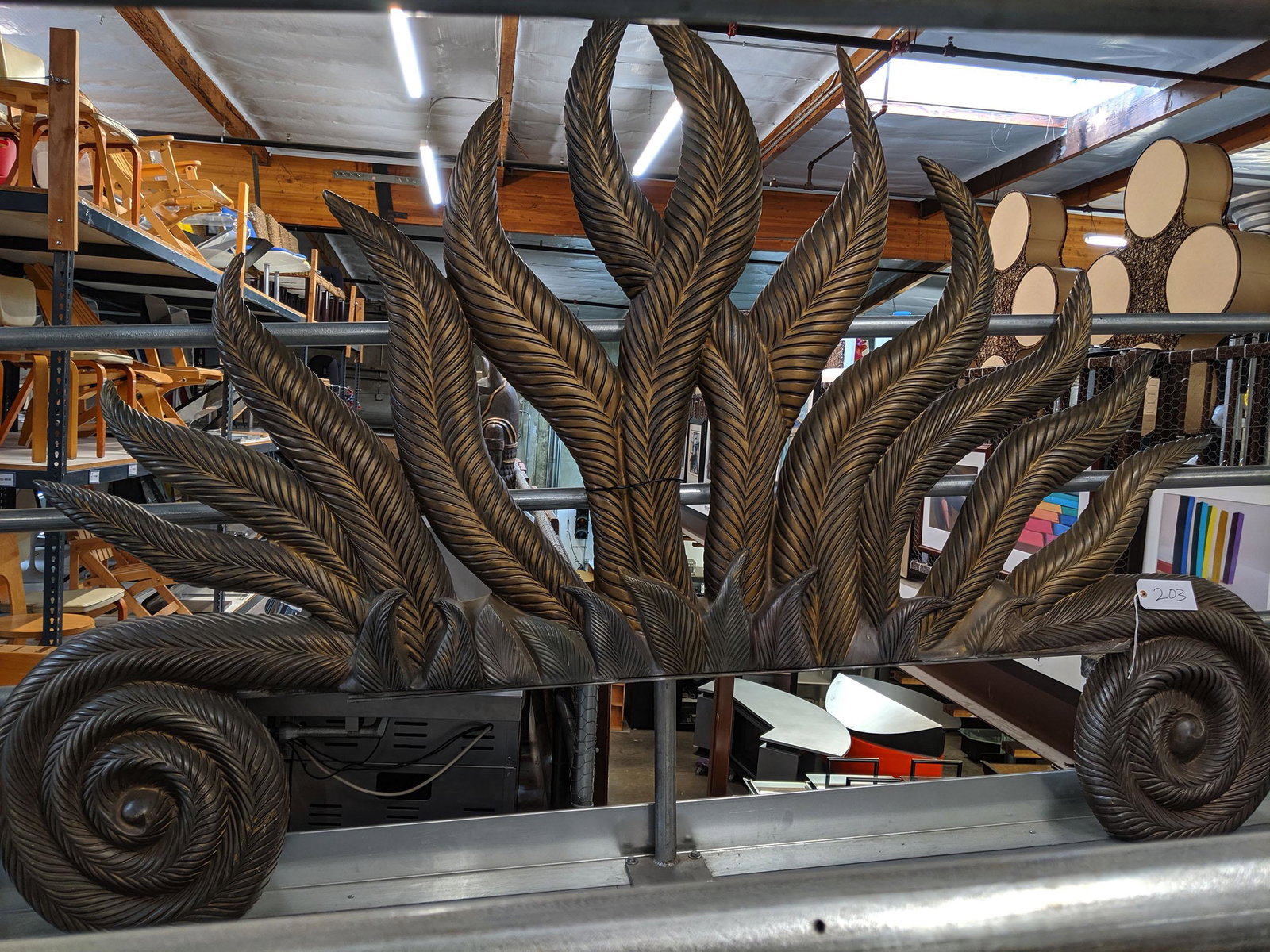 Leaf Headboard: Cast resin headboard in the shape of scrolling leaves.