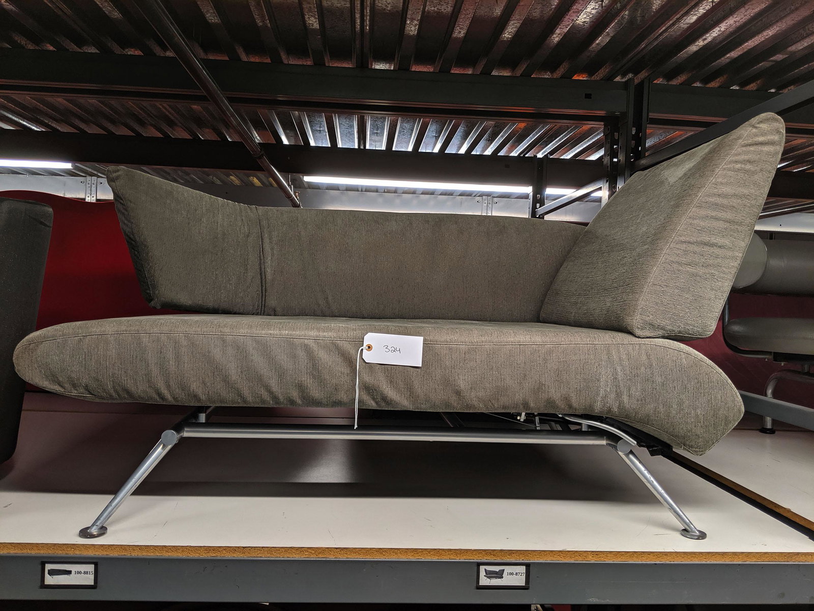 Asymmetrical German Sofa: Asymmetrical gray sofa with adjustable arm, Germany.