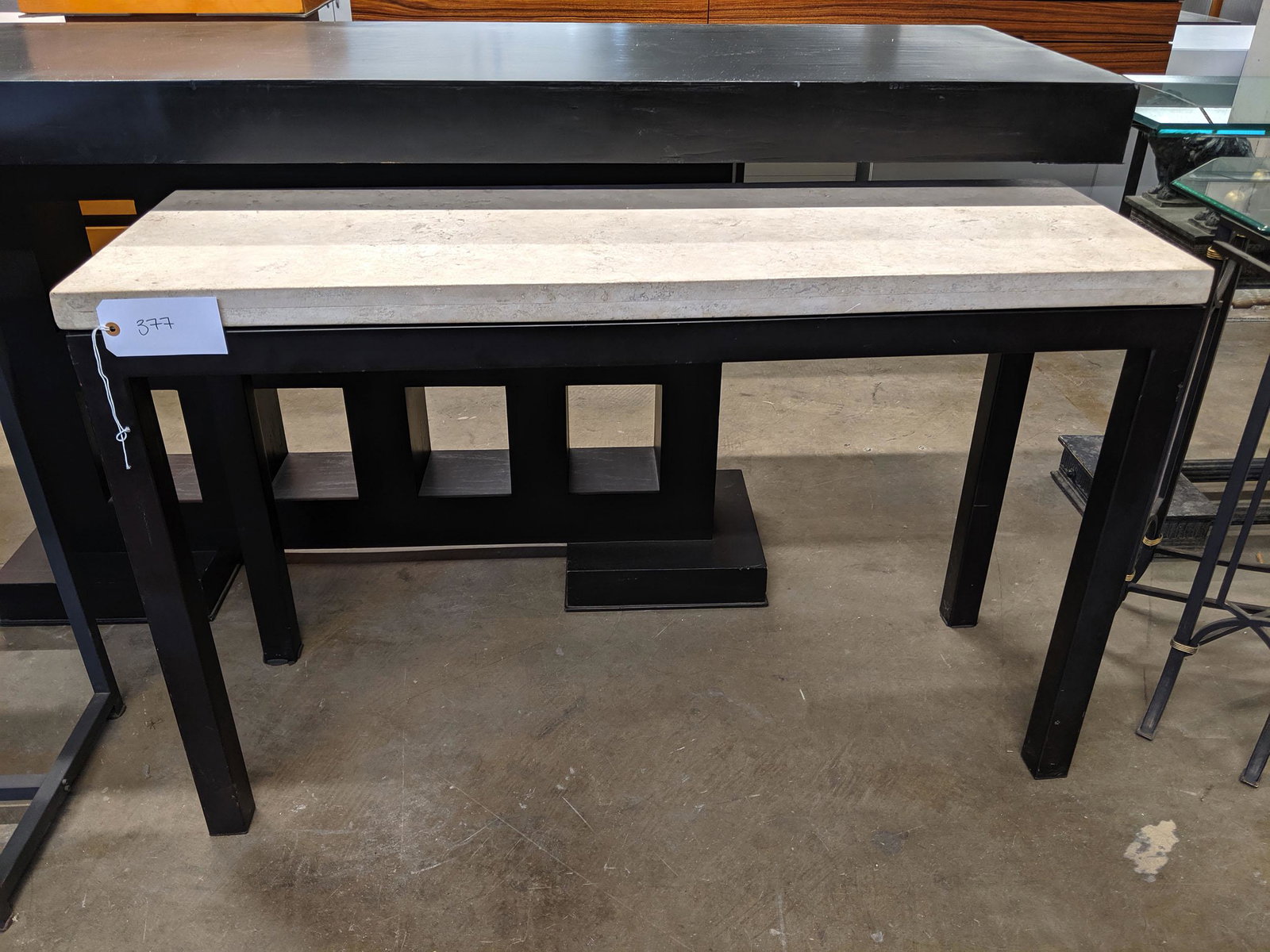 Console Table: Console table with stone top.