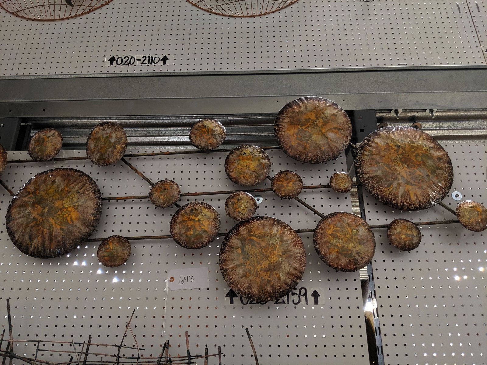 Circles Wall Sculpture: Metal wall sculpture with round disks.