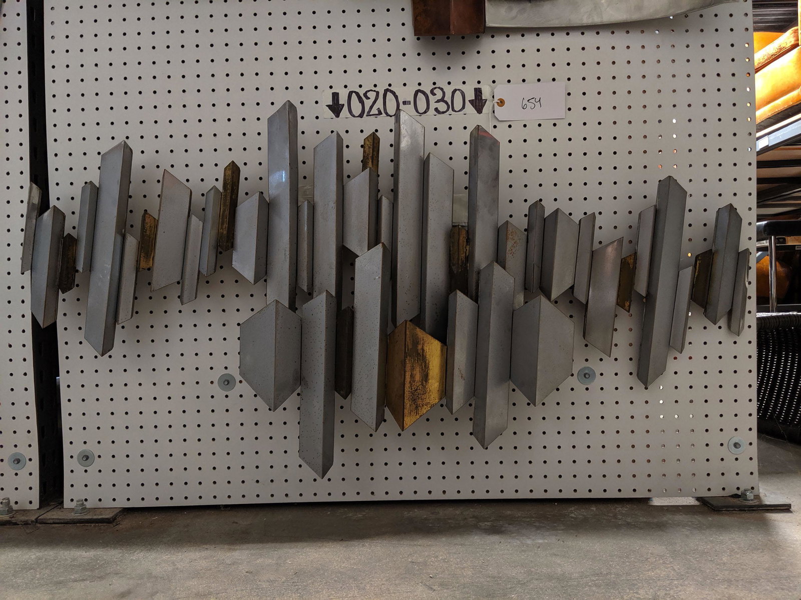 Faceted Wall Sculpture: Faceted metal wall sculpture.