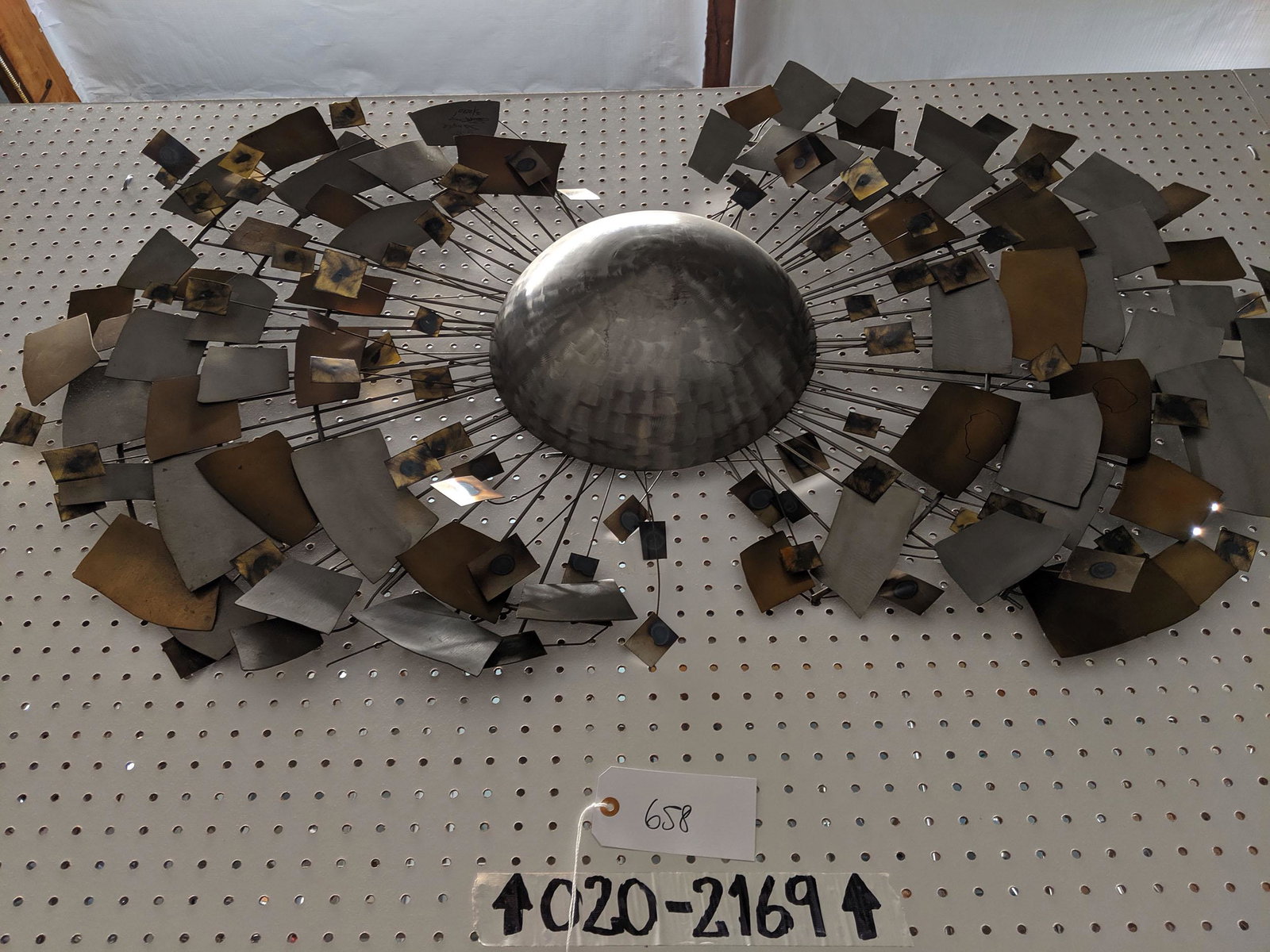Wall Sculpture: Metal wall sculpture.