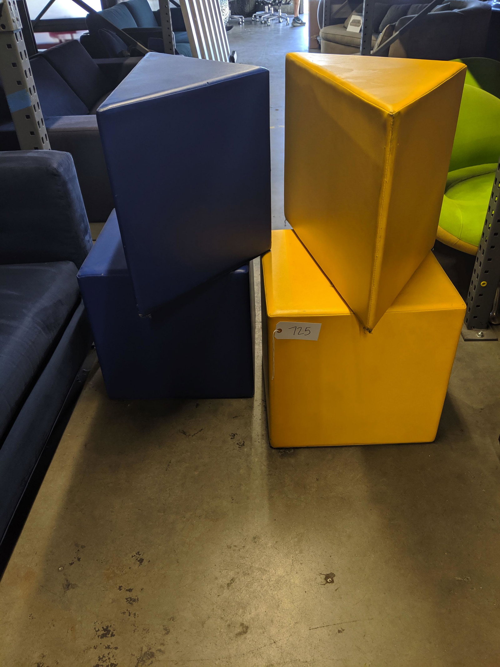 Geometric Stools: Blue and yellow vinyl geometric stools.