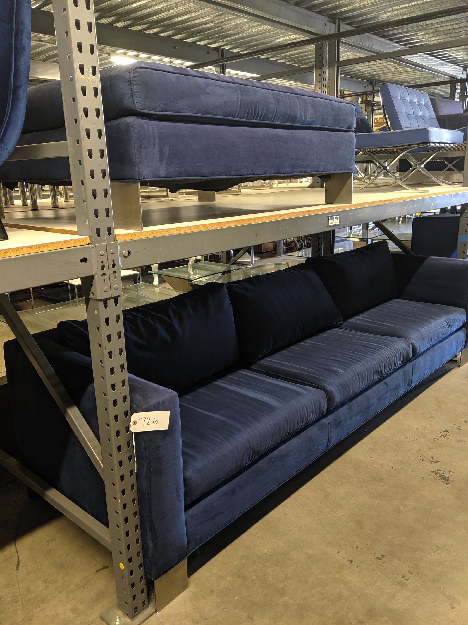 Oversized Sofa and Ottoman: Very large navy microsuede sofa and ottoman.