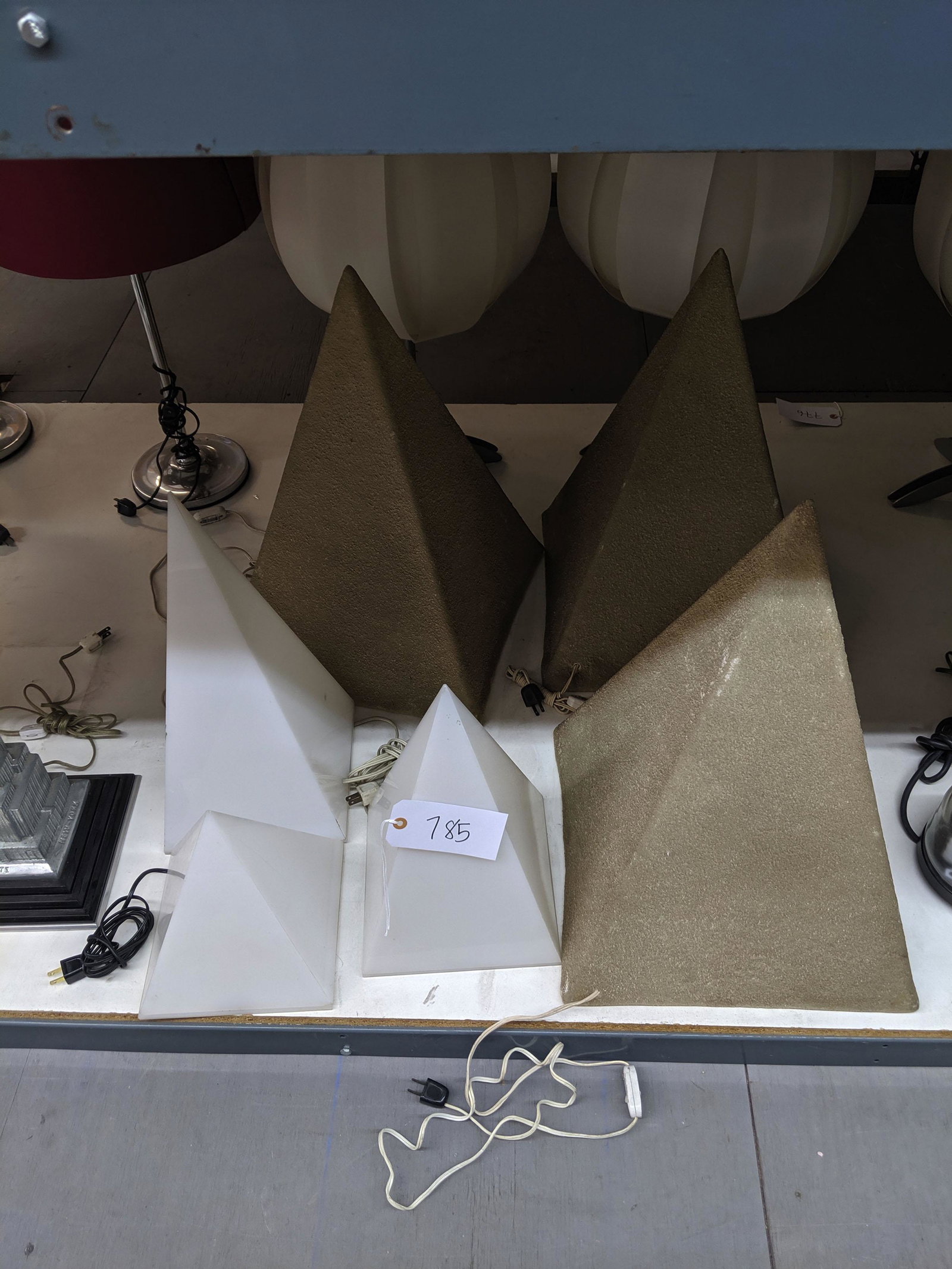 Andre Cazeneva Pyramid Lamps (12): Twelve pyramid lamps in various sizes.