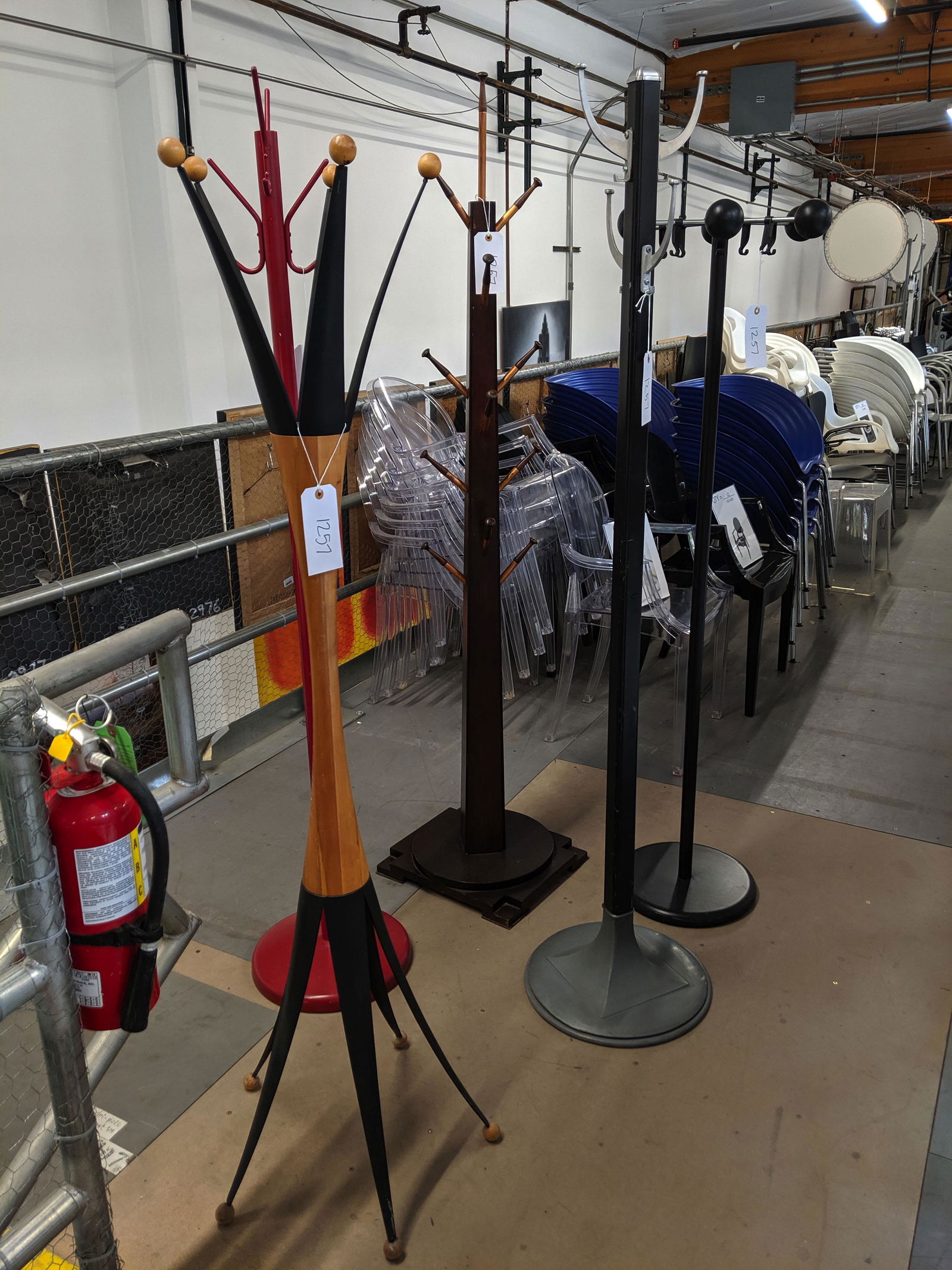 Coat Racks: Five coat racks of various design.