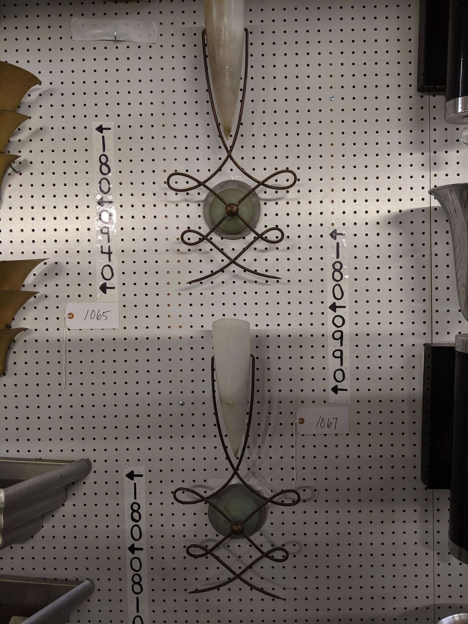 Wall Sconces: Set of three metal and glass wall sconces.