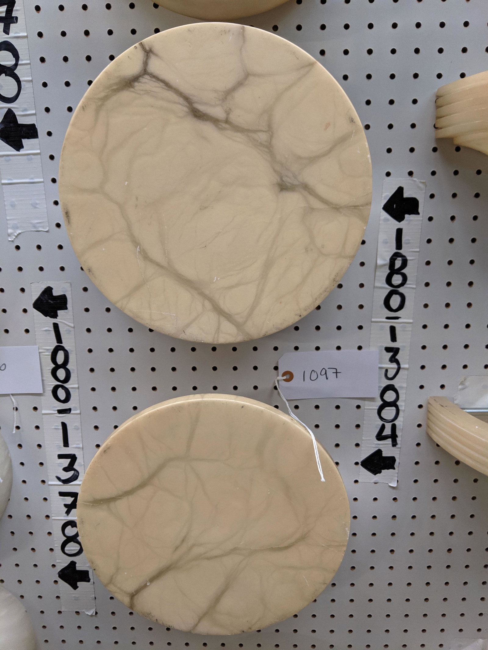 Circular Wall Sconces: Set of five circular stone wall sconces (not wired).