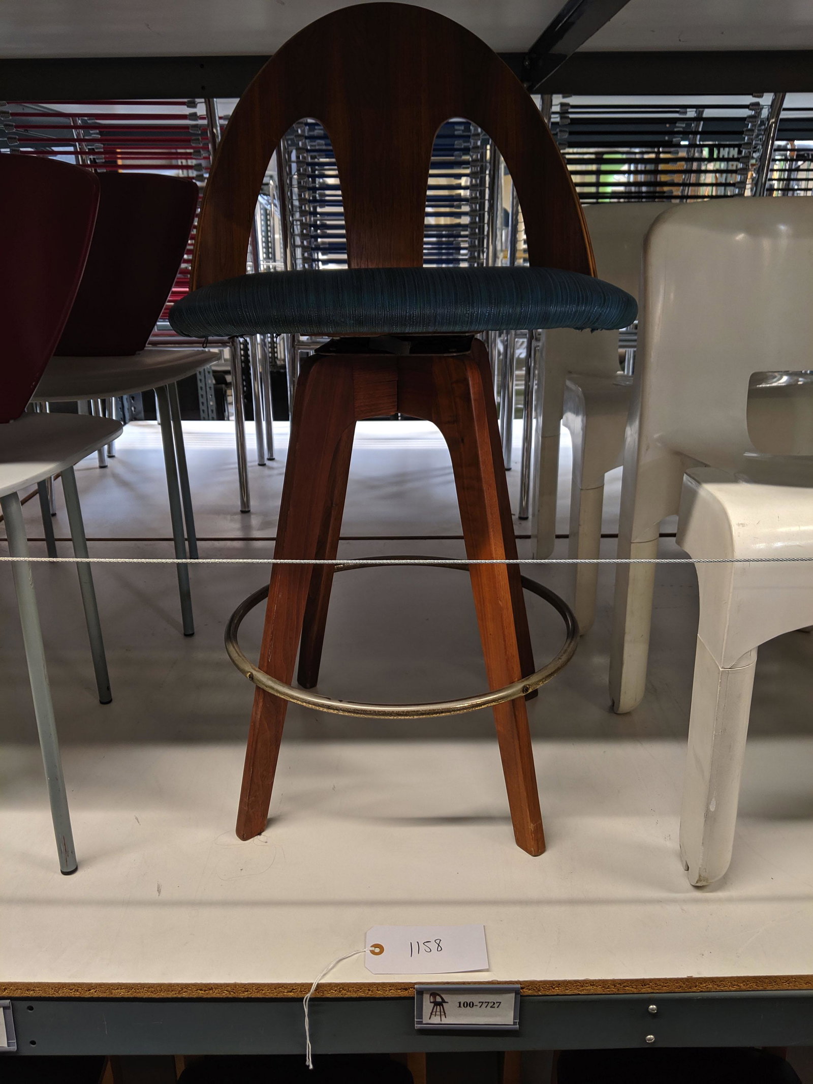Swiveling Bar Stool: Single swiveling bentwood bar stool.