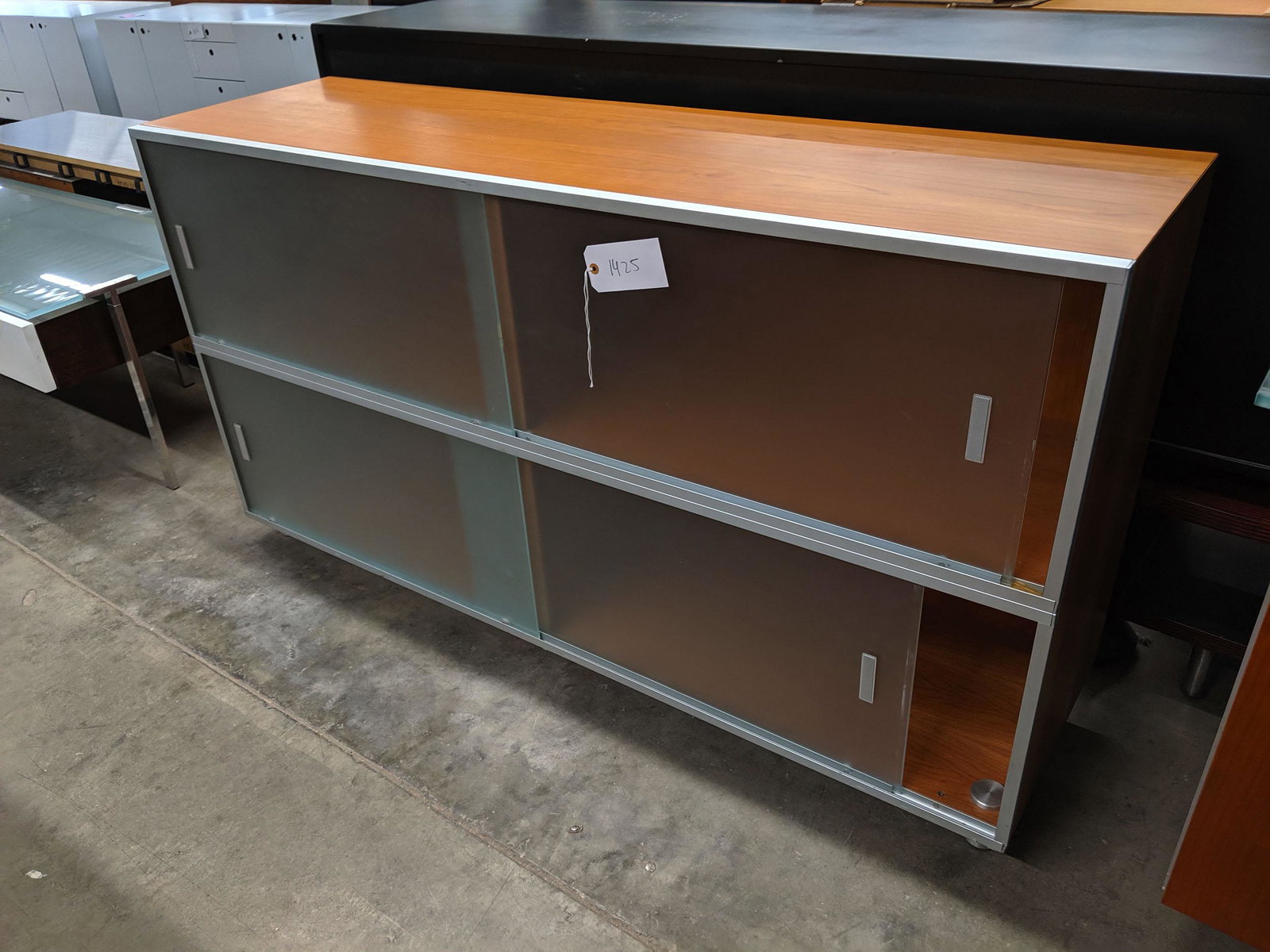 Modern Credenzas: Modern credenza with sliding glass doors.