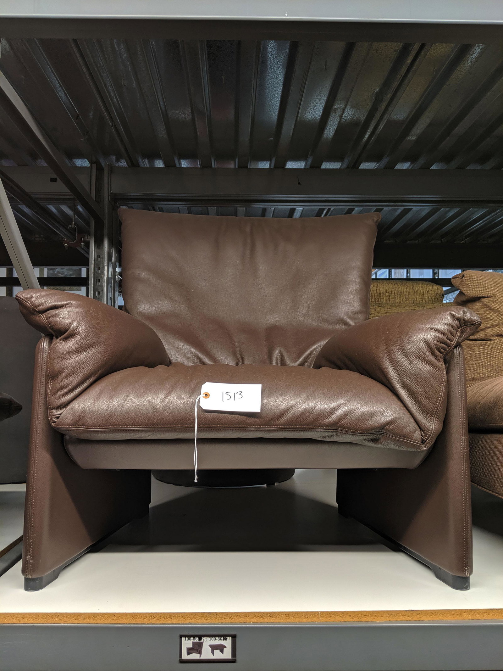 Cassina Lounge Chair and Ottoman: Brown leather lounge chair and ottoman by Cassina.