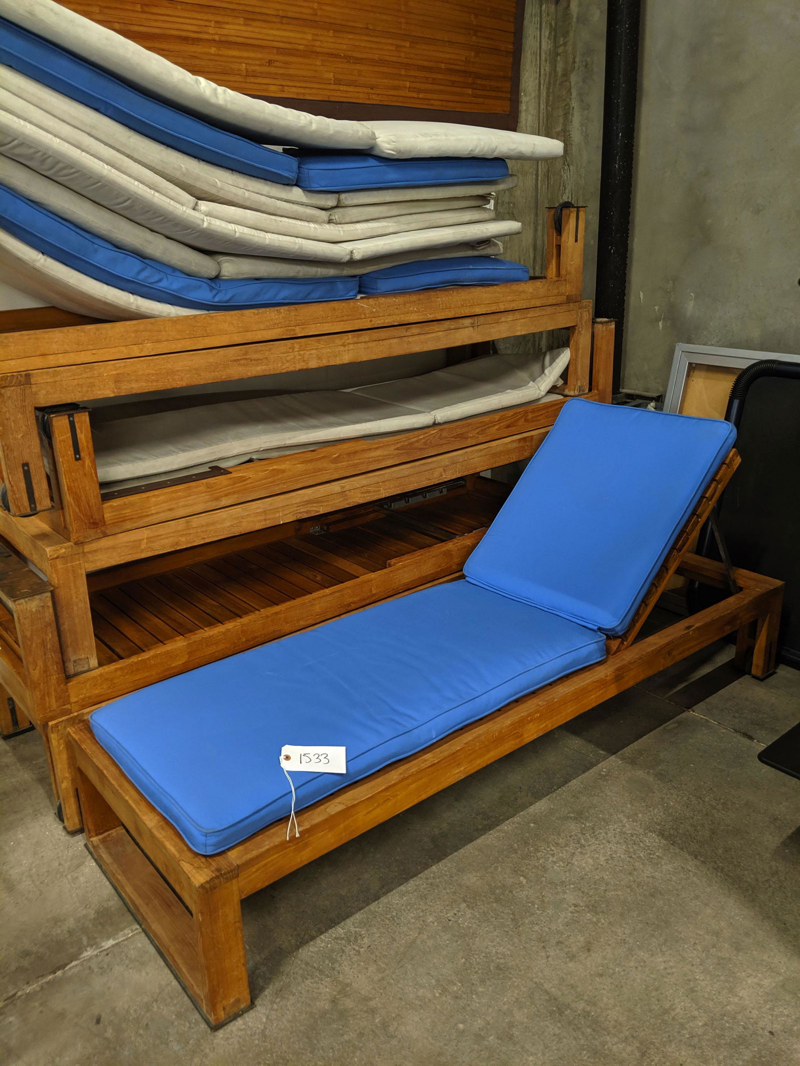 Teak Chaises (7): Set of seven slatted teak chaises with cushions.